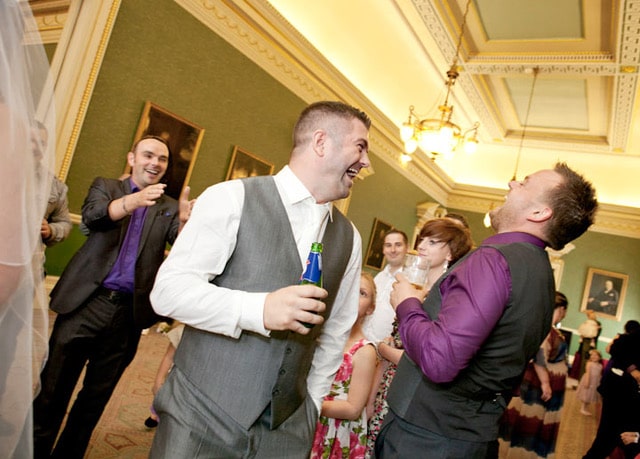 Wedding guests laughing during Craig the Magician's performance