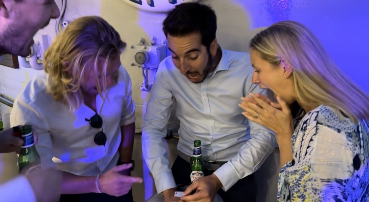 Corporate guests reacting to Interactive Magic's close-up magic