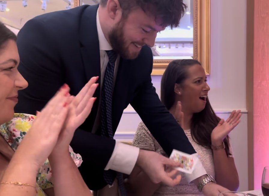 Interactive Magic performing magic for guests at a wedding