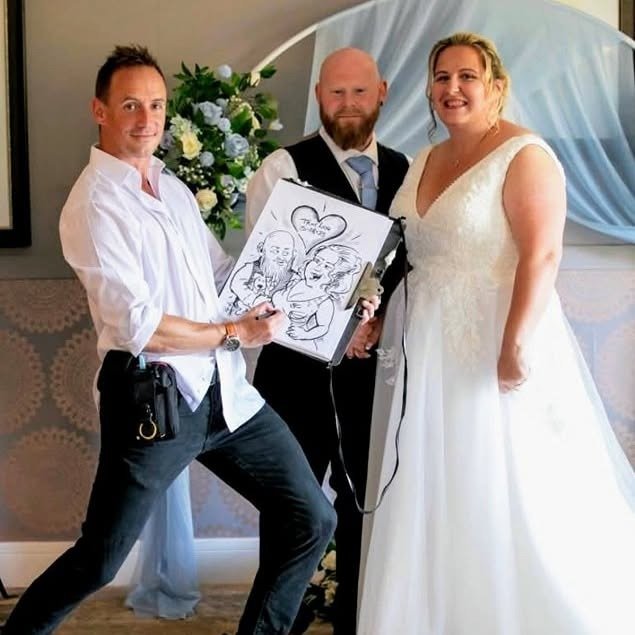 Bride and groom with their live wedding caricature