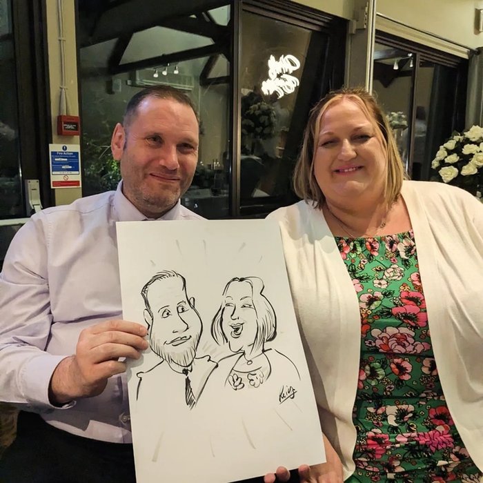 Couple with their live caricature