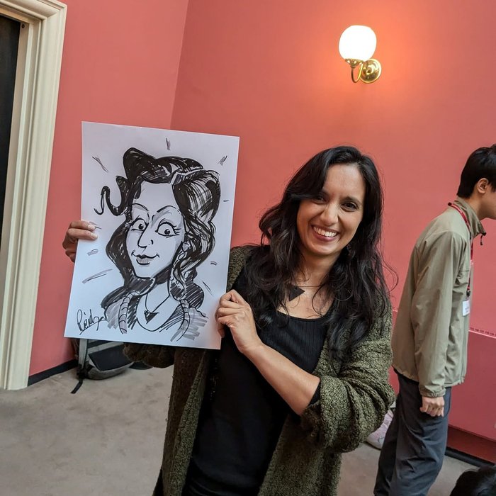 Guest with her live caricature