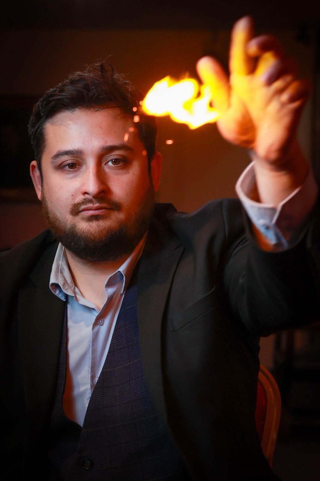 D.S. Magic producing a burst of flame from his hand during a close-up performance