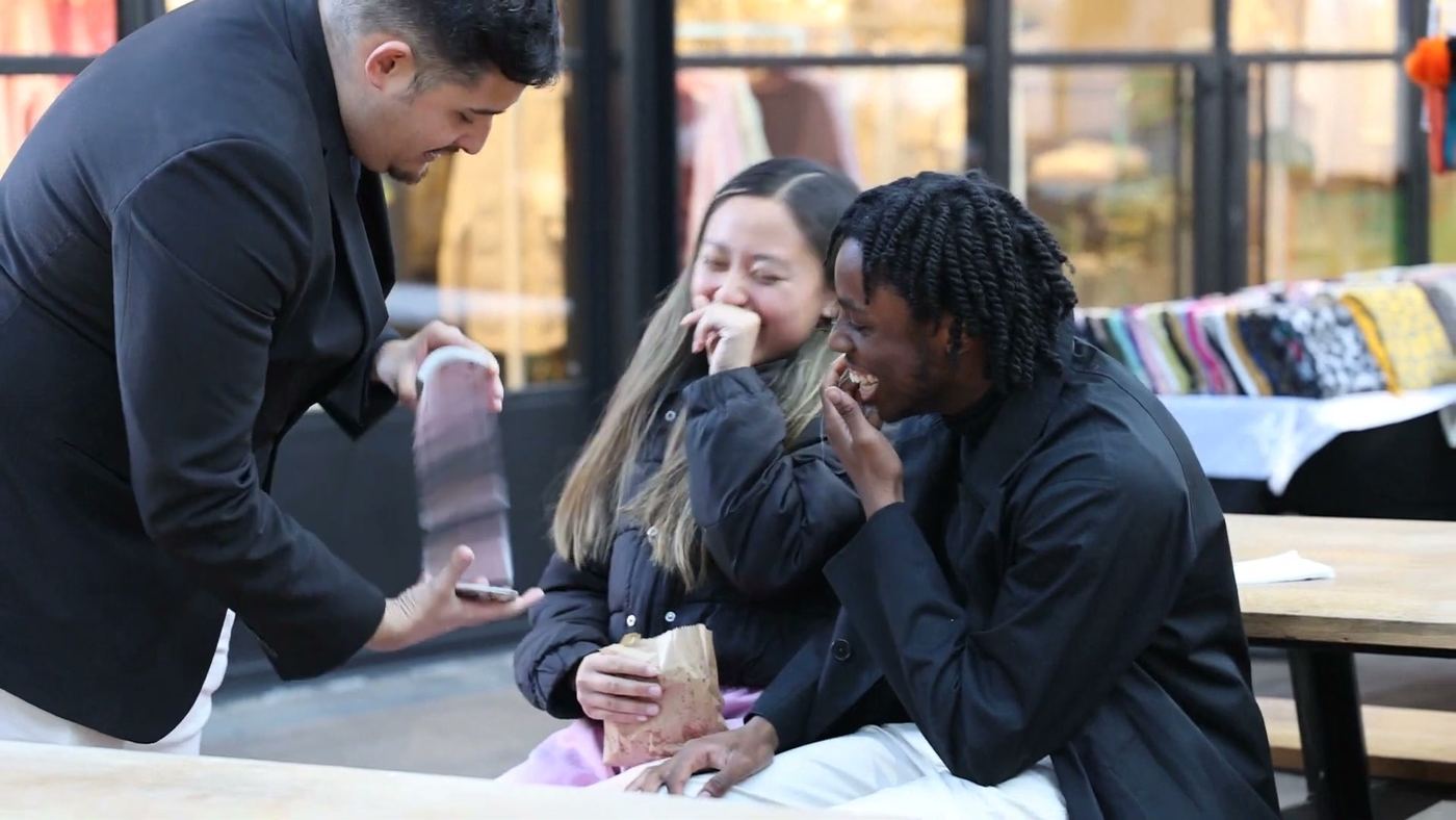 A guest covering her mouth in disbelief at a close-up trick