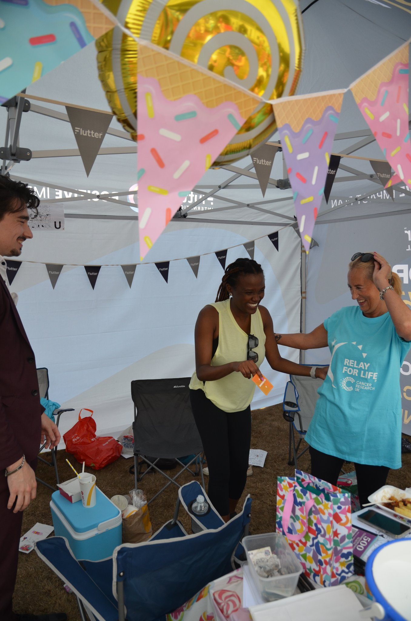 Performing magic for guests at a Relay for Life charity event