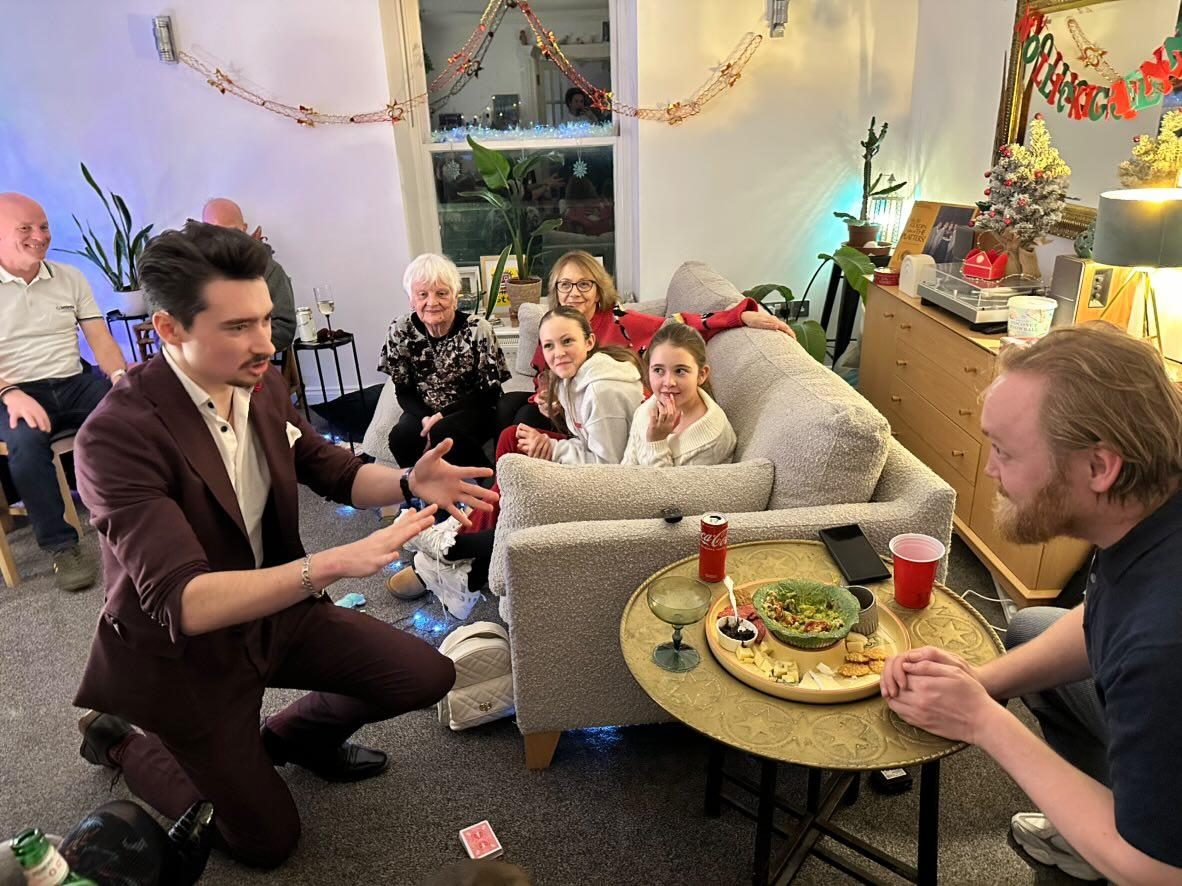 Guests watching a close-up routine at a private celebration