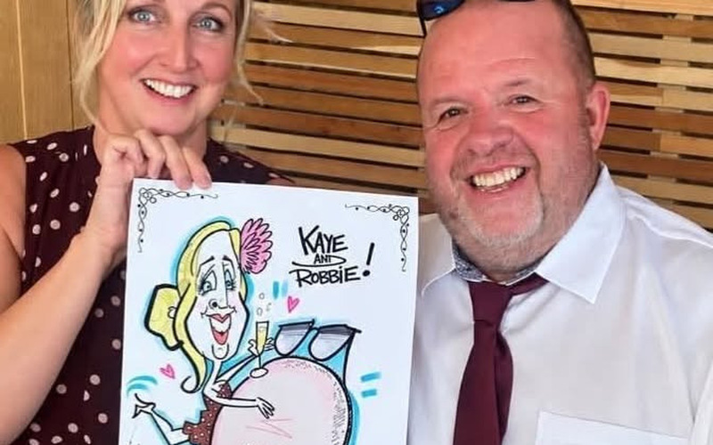 Cheeky Caricatures - couple with their live caricature