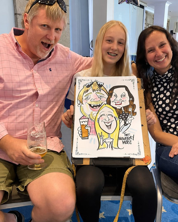 Family with their colour group caricature at a party