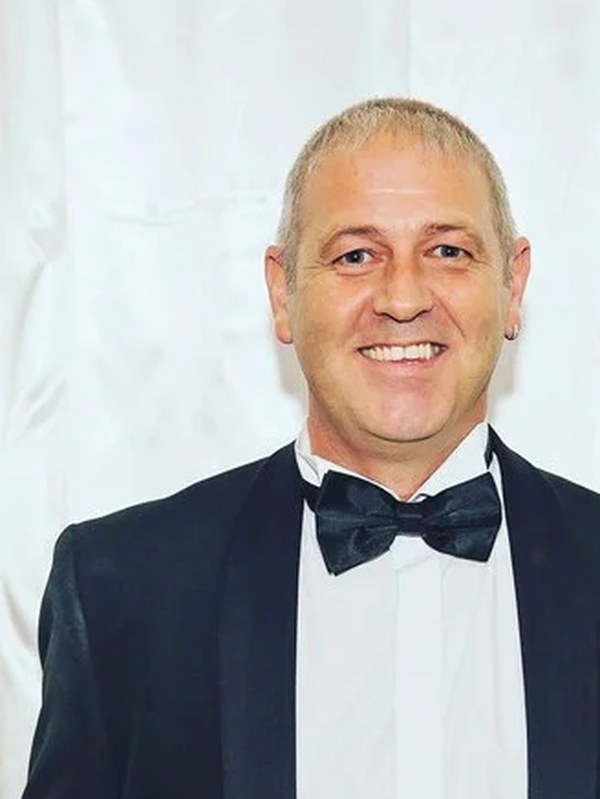 Curious Magic, close-up magician, in black tie at an evening event