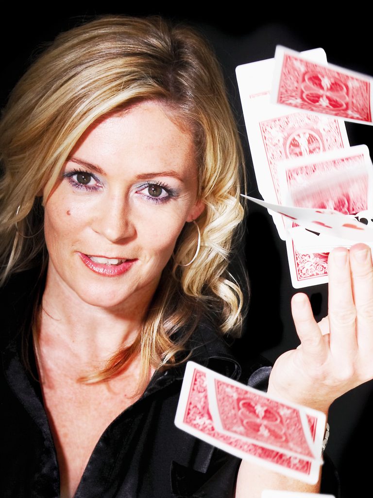 Aurora Myst, a female magician from Huddersfield, cascading playing cards