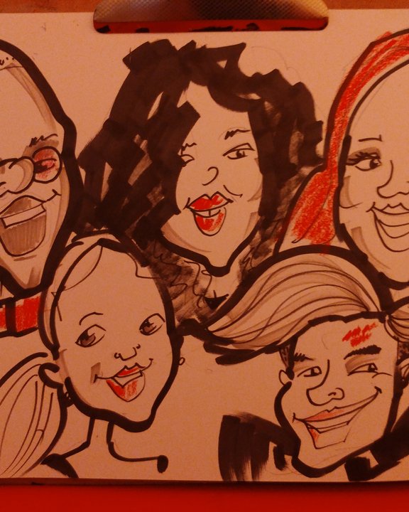 Group holding their caricature at a university ball