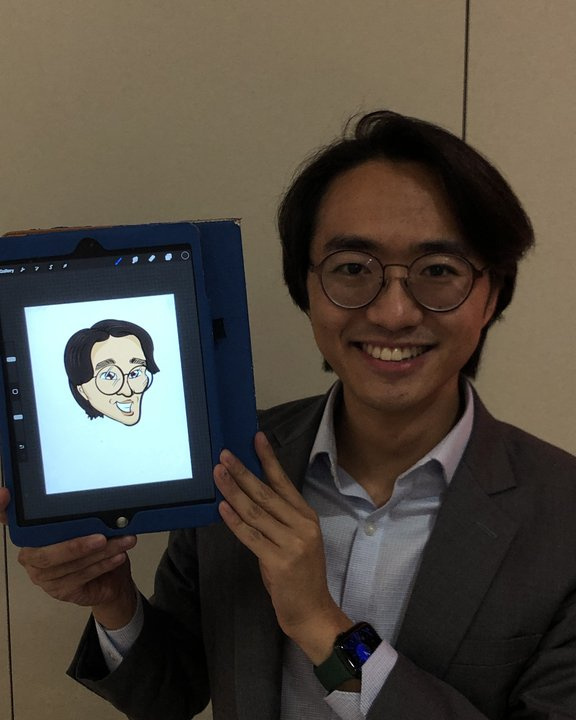 Guest holding a digital caricature drawn live on an iPad