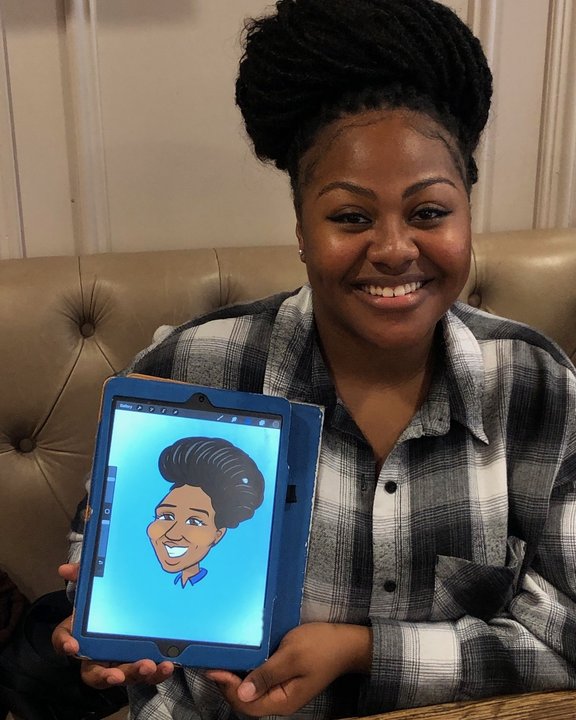 Guest holding her digital iPad caricature