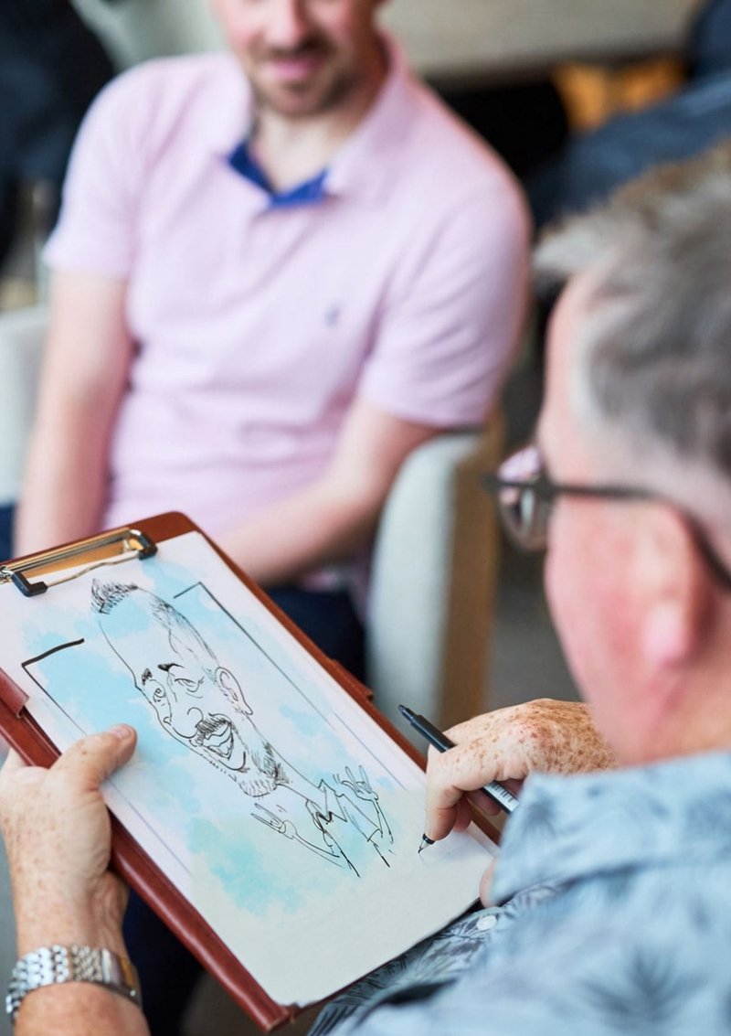 Cheerful Caricatures sketching a guest live at an event