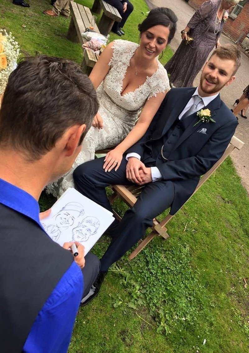 Dragon Caricatures drawing a bride and groom in a wedding garden