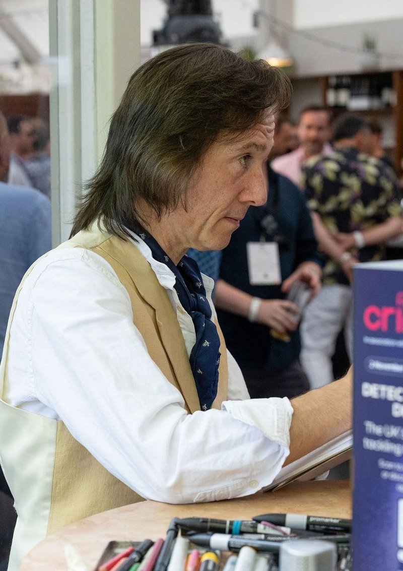 Headline Caricatures drawing a guest at a corporate summer party