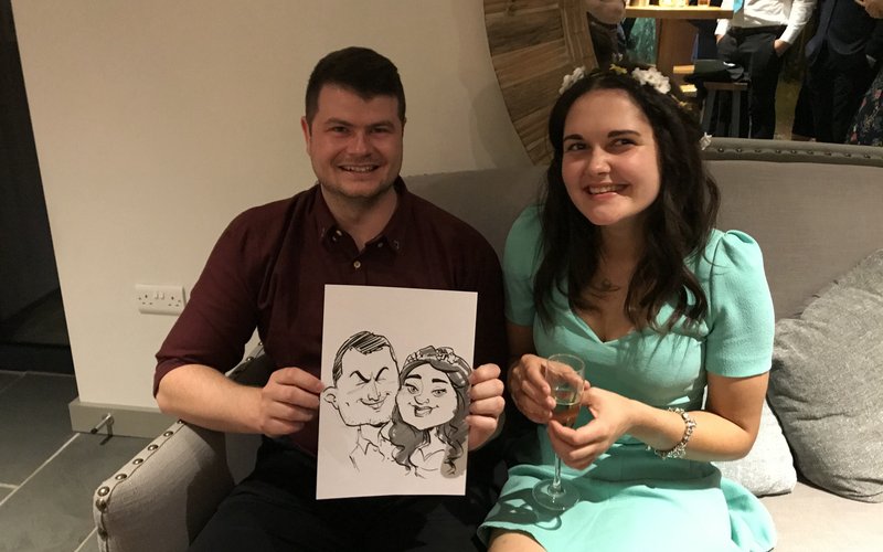 Jolly Caricatures - couple with their live caricature