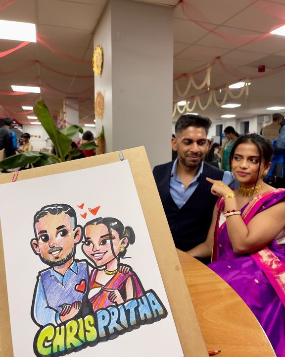 Couple at a celebration with their colour couple caricature